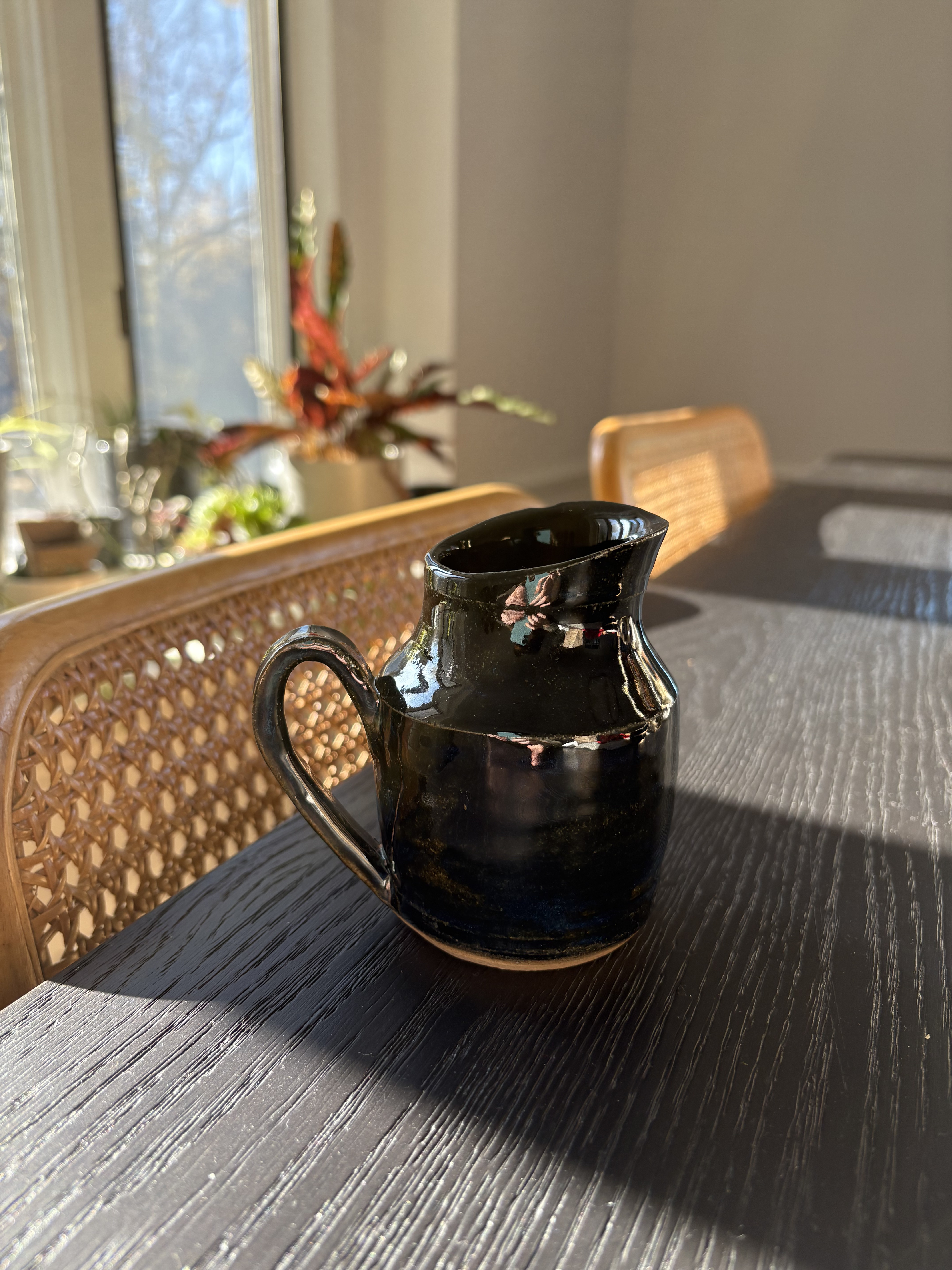 Handcrafted black glazed ceramic pitcher